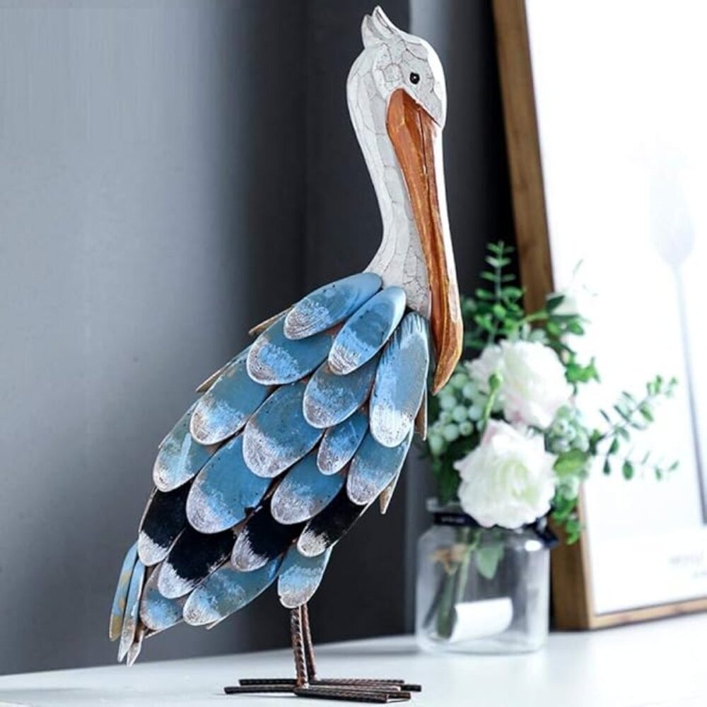 18 Inch wood and metal Pelican sclpture hand painted. 18inches tall.